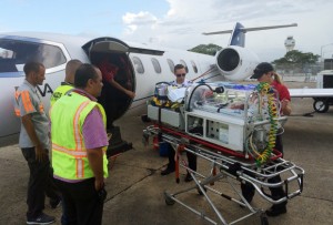 In this Sept. 4, 2015, photo provided by Emily Morgan, amedical flight prepares to leave San Juan in Puerto Rico as Morgan's newborn baby is transported on the way to Miami. The Utah woman who unexpectedly gave birth on a cruise ship months before her due date says she wrapped towels around her boy and, with the help of medical staff, managed to keep him alive until the ship reached port. He's now receiving care at a neonatal intensive care unit in Miami. (Emily Morgan via AP)